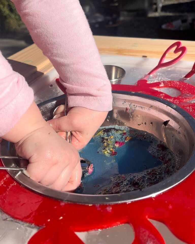 little girl scoops up magic potion